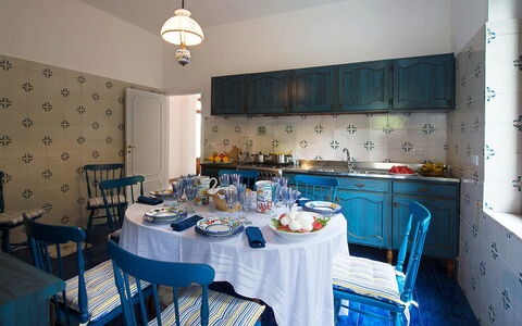 Villa Sam: Furniture, Blue, Interior Design, Flooring, Table, Textile, Dining Room, Tablecloth, Lighting, Chair