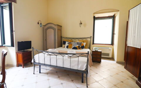 Scilla Centro Storico Otranto: Bed, Wall, Bedroom, Furniture, Interior Design, Floor, Flooring, Bed Sheet, Bedding, Bed Frame