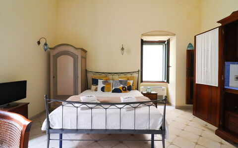 Scilla Centro Storico Otranto: Furniture, Bed, Bedroom, Wall, Interior Design, Bed Sheet, Wood, Bedding, Floor, Flooring