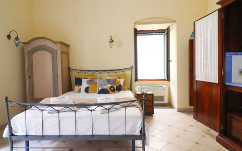 Scilla Centro Storico Otranto: Bed, Furniture, Bedroom, Wall, Bedding, Bed Sheet, Interior Design, Wood, Floor, Room