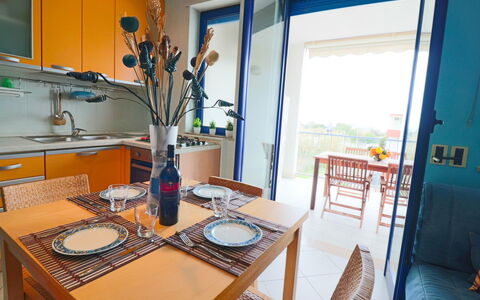 Circe Sea View: Flooring, Interior Design, Furniture, Floor, Apartment, Chair, Wood Stain, Kitchen & Dining Room Table, Houseplant, Dining Room