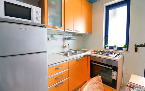 Circe Sea View: Kitchen, Kitchen Appliance, Major Appliance, Countertop, Wood, Kitchen Sink, Kitchen Stove, Cabinetry, Stove, Interior Design