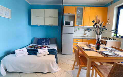 Circe Sea View: Furniture, Interior Design, Room, Flooring, Floor, Apartment, Bedroom, Bed, Chair, Linens