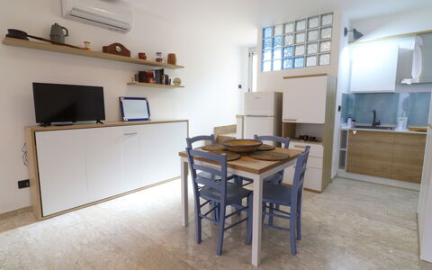 Malika: Furniture, Flooring, Interior Design, Wood, Floor, Room, Apartment, Cabinetry, Countertop, Kitchen