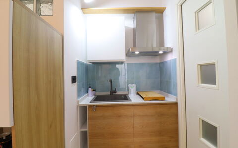 Malika: Interior Design, Kitchen, Wall, Kitchen Appliance, Major Appliance, Countertop, Flooring, Wood, Cabinetry, Floor