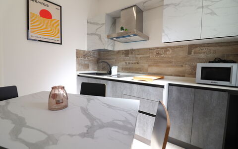 Malika: Furniture, Flooring, Floor, Countertop, Chair, Kitchen, Natural Material, Cabinetry, Kitchen & Dining Room Table