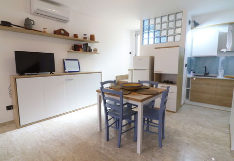 Malika: Furniture, Flooring, Interior Design, Wood, Floor, Room, Apartment, Cabinetry, Countertop, Kitchen