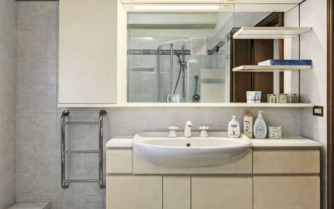 Etrusco Apartment: Interior Design, Bathroom Sink, Plumbing Fixture, Sink, Flooring, Cabinetry, Mirror, Bathroom, Furniture, Bathroom Cabinet
