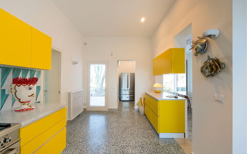 Villa Rebecca: Flooring, Kitchen, Interior Design, Yellow, Floor, Ceiling, Countertop, Major Appliance, Cabinetry, Kitchen Appliance