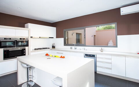 Villa Jamalu: Kitchen, Interior Design, Cabinetry, Countertop, Kitchen Appliance, Flooring, Ceiling, Wood, Furniture, Light Fixture