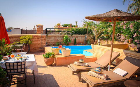 Riad Ikram: Swimming Pool, Furniture, Resort, Outdoor Furniture, Sunlounger, Flowerpot, Chair, Umbrella, Houseplant, Eco Hotel