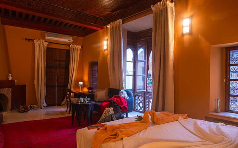 Riad Ikram: Interior Design, Lighting, Room, Ceiling, Wood Stain, Light Fixture, Hardwood, Molding, Chair, Curtain