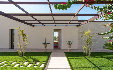 Villa Miriam: Garden, Shade, Landscaping, Lawn, Yard, Outdoor Structure, Artificial Turf, Backyard, Courtyard, Pergola