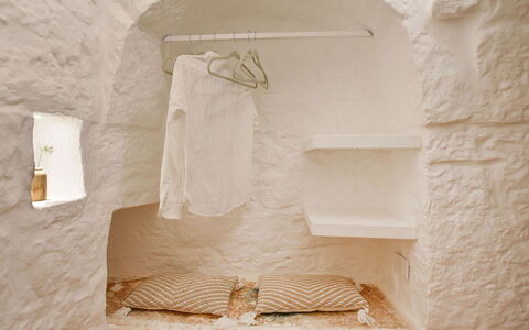 Trulli Fontana: Wall, Ceiling, Room, Linens, Bedroom, Natural Material, Bedding, Plaster, Bed Sheet, Light Fixture