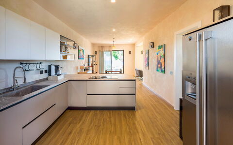 Villa Paprika: Kitchen, Countertop, Kitchen Appliance, Furniture, Interior Design, Flooring, Major Appliance, Cabinetry, Floor, Wood