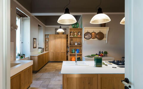 Villa Milo: Interior Design, Furniture, Kitchen, Wood, Countertop, Light Fixture, Ceiling, Cabinetry, Flooring, Lighting