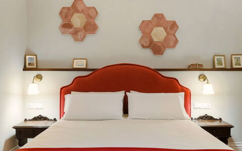 Villa Milo: Wall, Interior Design, Bedroom, Wood, Furniture, Bed Sheet, Bedding, Lighting, Bed, Orange