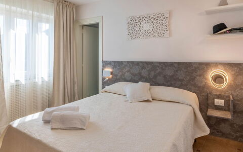Villa Pietraluna: Interior Design, Bedroom, Bed, Floor, Flooring, Bed Sheet, Furniture, Bedding, Wood, Ceiling