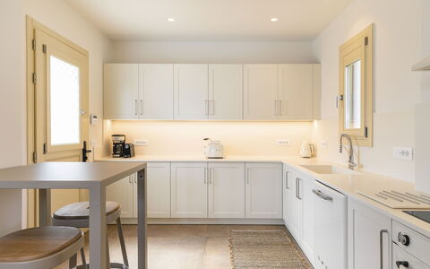 Villa Wolf: Kitchen, Furniture, Countertop, Interior Design, Cabinetry, Kitchen Appliance, Flooring, Wood, Floor, Major Appliance