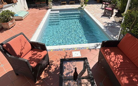 Villa Ava: Swimming Pool, Floor, Flooring, Outdoor Furniture, Furniture, Composite Material, Tile, Chair, Shade, Flowerpot