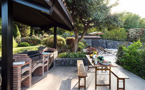 Villa Monte Serra: Shrub, Garden, Shade, Flowerpot, Outdoor Furniture, Landscaping, Flagstone, Outdoor Structure, Backyard, Outdoor Table