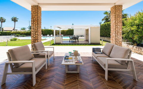 Villa Agorà: Furniture, Flooring, Wood, Chair, Interior Design, Floor, Table, Outdoor Furniture, Living Room, Resort
