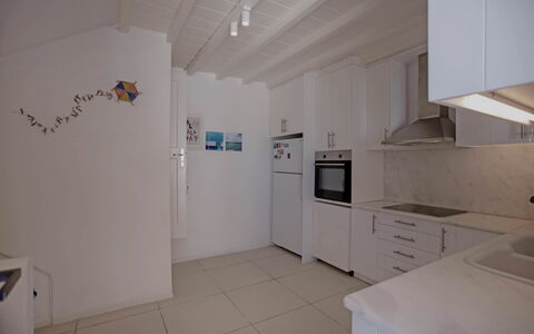 Villa Talassa: Flooring, Floor, Interior Design, Wood, Ceiling, Countertop, Furniture, Kitchen, Major Appliance, Lighting