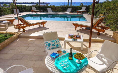 Casa Leuca: Furniture, Chair, Outdoor Furniture, Table, Resort, Umbrella, Outdoor Table, Shade, Swimming Pool, Coffee Table