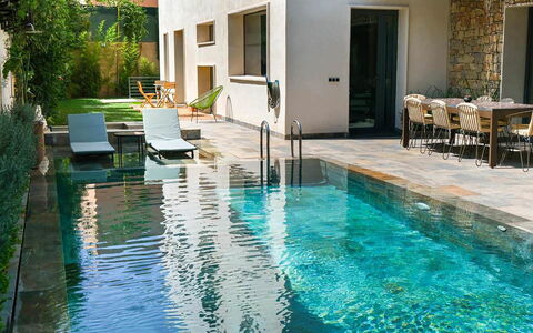 Villa Habiba: Swimming Pool, Composite Material, Water Feature, Backyard, Outdoor Furniture, Reflection, Resort, Tile, Chair, Flagstone