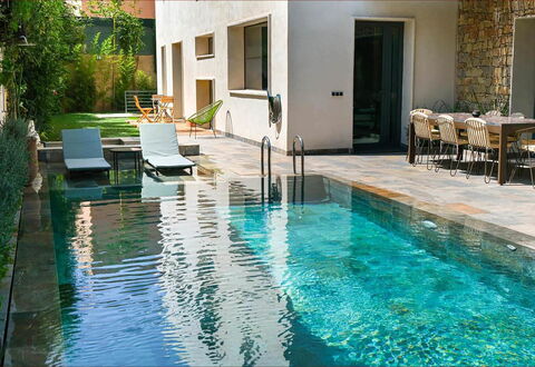 Villa Habiba: Swimming Pool, Composite Material, Water Feature, Backyard, Outdoor Furniture, Reflection, Resort, Tile, Chair, Flagstone