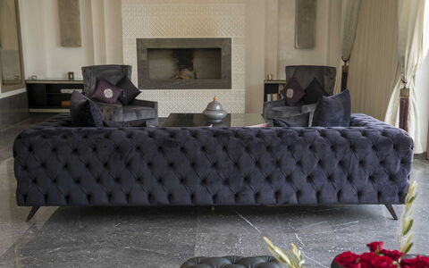 Villa Malak: Couch, Furniture, Living Room, Throw Pillow, Natural Material, Pillow, Leather