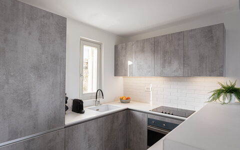 Villa Aspasia: Wall, Flooring, Countertop, Kitchen, Floor, Interior Design, Home, Composite Material, Kitchen Appliance, Cabinetry