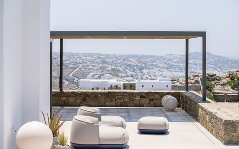 Villa Achille: Furniture, Floor, Couch, Living Room, Natural Material, Shade, Chair, Design, Houseplant