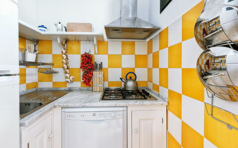 Casa Mauro: Yellow, Kitchen, Interior Design, Flooring, Floor, Kitchen Appliance, Major Appliance, Tile, Countertop, Kitchen Stove