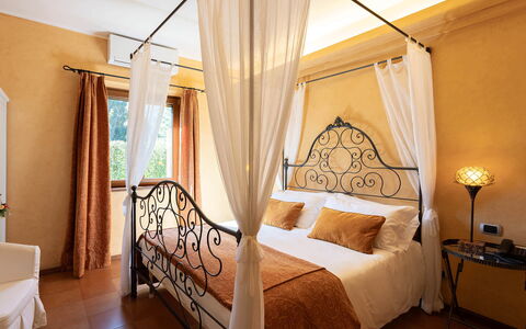 Villa Brin: Furniture, Interior Design, Bed, Bedroom, Ceiling, Floor, Flooring, Linens, Room, Lighting