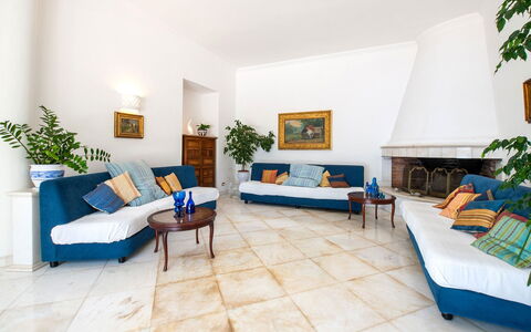 Villa Lamaro: Furniture, Flooring, Floor, Interior Design, Couch, Living Room, Lighting, Room, Ceiling