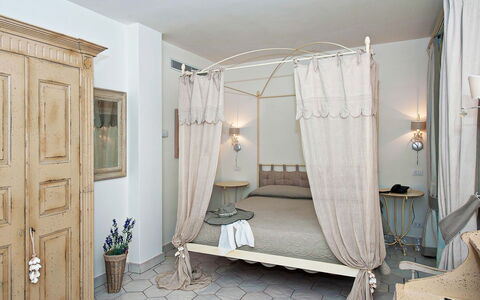 Villa Moresca: Furniture, Bed, Interior Design, Bedroom, Wall, Wood, Floor, Bedding, Room, Flooring