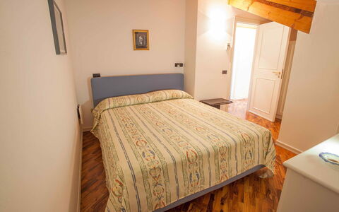 Casa Amalfitana: Bed, Bedroom, Bedding, Bed Sheet, Interior Design, Floor, Wood, Linens, Room, Textile