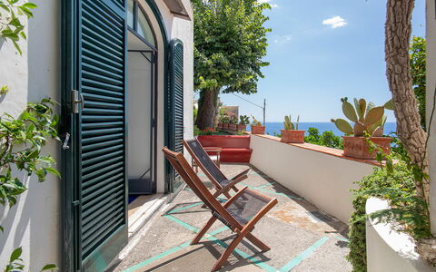 Casa Giardino: Blue, Sea, Ocean, Balcony, Flowerpot, Coast, Shade, Houseplant, Outdoor Furniture, Chair