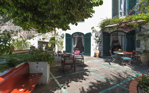 Casa Giardino: Flowerpot, Door, Houseplant, Outdoor Furniture, Outdoor Table, Chair, Balcony, Shade, Hacienda, Courtyard