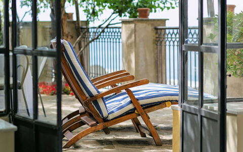 Casa la Sponda: Furniture, Chair, Outdoor Furniture, Balcony, Iron, Porch, Shade, Wood Stain, Hardwood, Houseplant