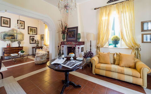 Green Villa: Furniture, Interior Design, Flooring, Table, Floor, Ceiling, Chair, Room, Lighting, Living Room