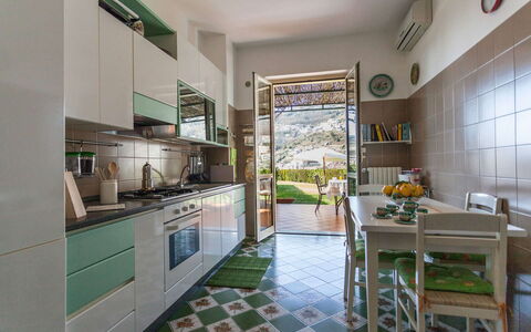 Il Giardino di Ravello: Kitchen, Furniture, Kitchen Appliance, Interior Design, Flooring, Major Appliance, Countertop, Floor, Home Appliance, Chair