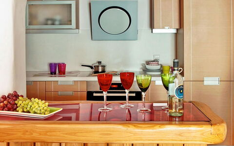 Queen Villa: Furniture, Kitchen, Wood, Countertop, Interior Design, Tableware, Cabinetry, Kitchen Appliance, Flooring, Bottle