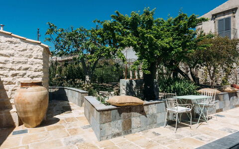 Villa Acreide: Flowerpot, Flagstone, Outdoor Furniture, Garden, Shade, Concrete, Houseplant, Chair, Landscaping, Courtyard