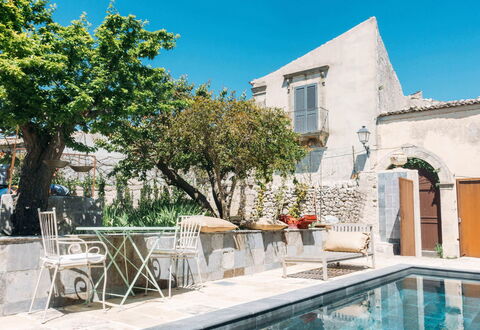 Villa Acreide: Wall, Flowerpot, Outdoor Furniture, Flagstone, Concrete, Houseplant, Courtyard, Chair, Swimming Pool, Villa