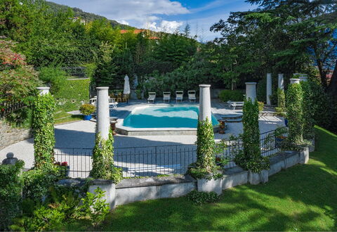 Villa Camilla: Swimming Pool, Garden, Resort, Landscaping, Shade, Outdoor Furniture, Water Feature, Flagstone, Backyard, Umbrella