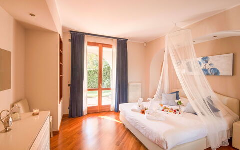Villa Cremia: Furniture, Interior Design, Wood, Floor, Bedroom, Bed, Flooring, Lighting, Ceiling, Room