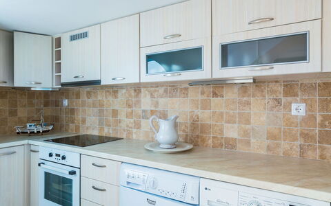 Villa Crystal: Countertop, Cabinetry, Kitchen, Flooring, Wood, Kitchen Appliance, Major Appliance, Drawer, Interior Design, Cupboard