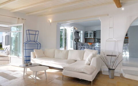 Villa Delos: Furniture, Interior Design, Flooring, Floor, Couch, Ceiling, Table, Living Room, Home, Lighting
